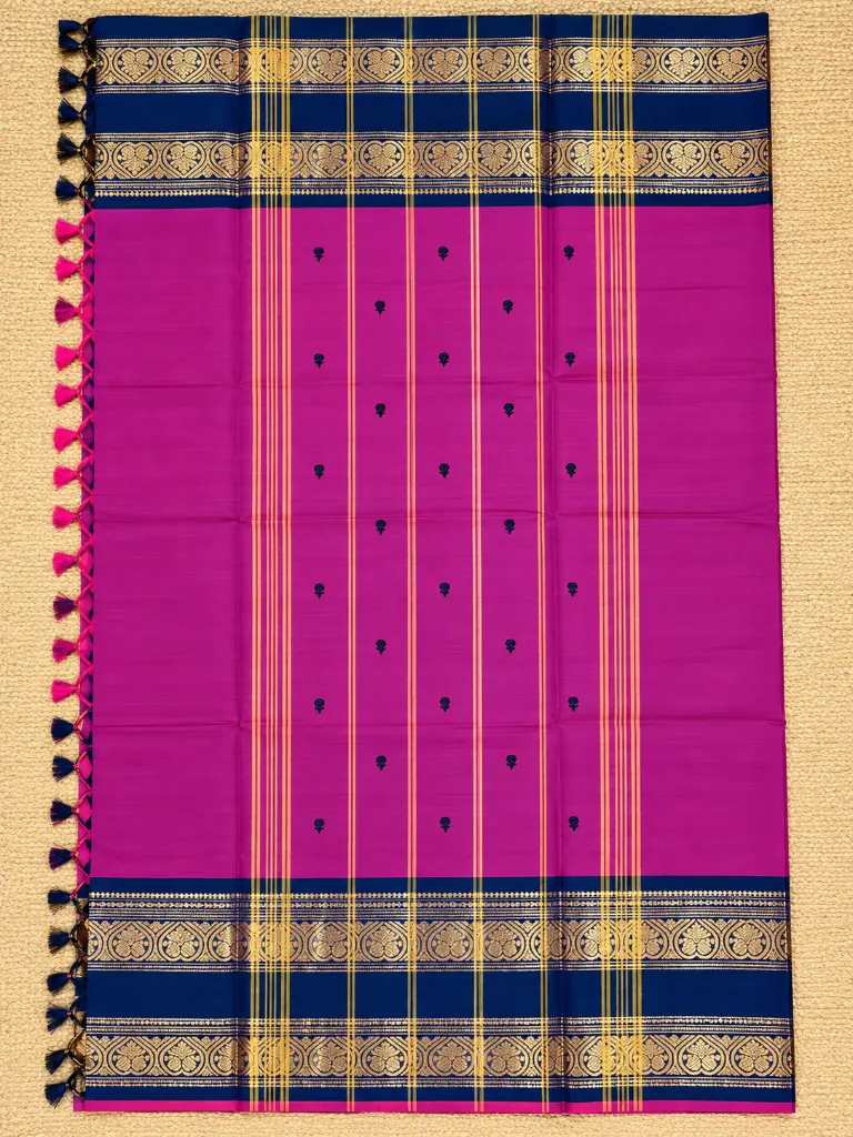 Magenta Silk Saree on Woven Mat.webp